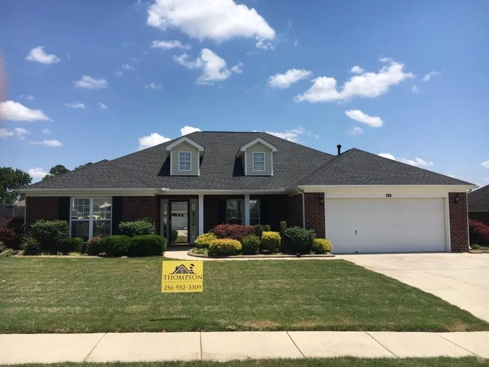 Slide of Thompson Roofing and Construction