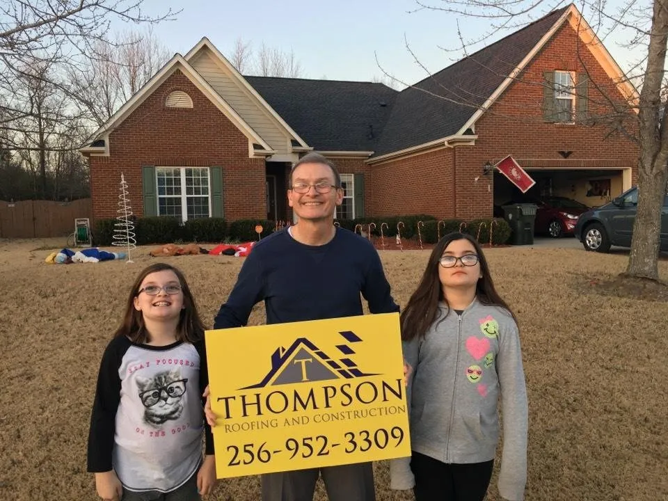 Slide of Thompson Roofing and Construction