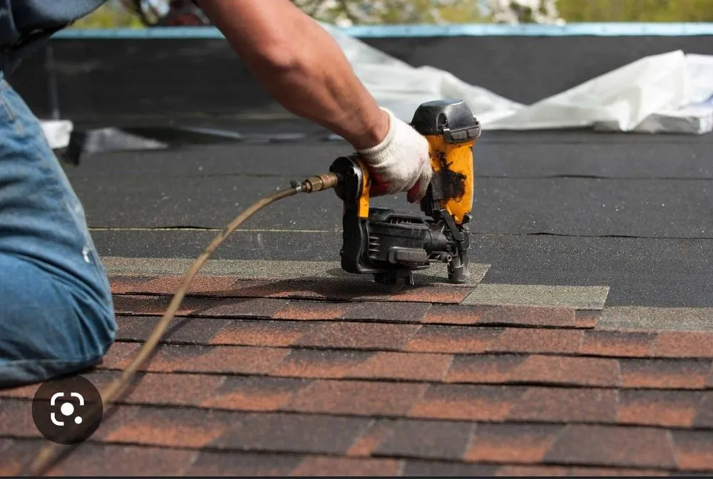 Slide of Thompson's roofing