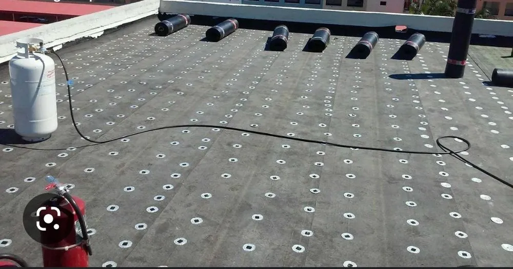 Slide of Thompson's roofing