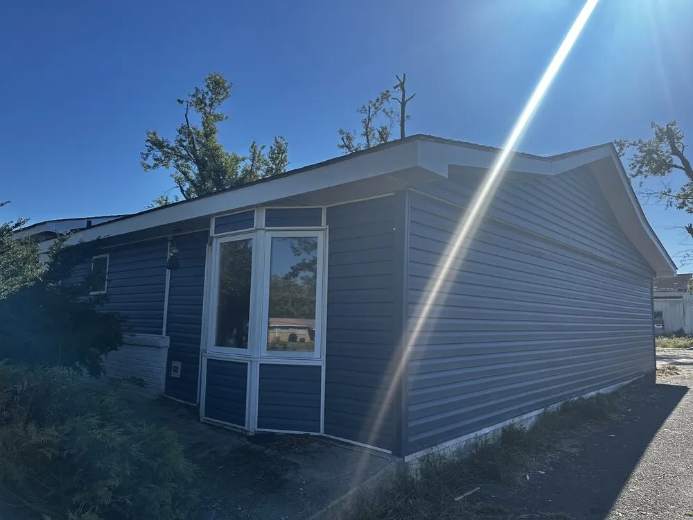 Slide of Thoroughbred Roofing & Home Design