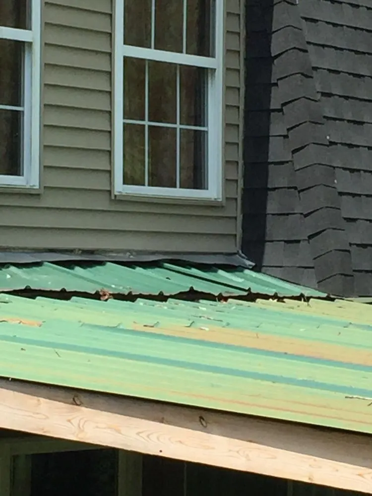 Slide of Thoroughbred Roofing & Home Design