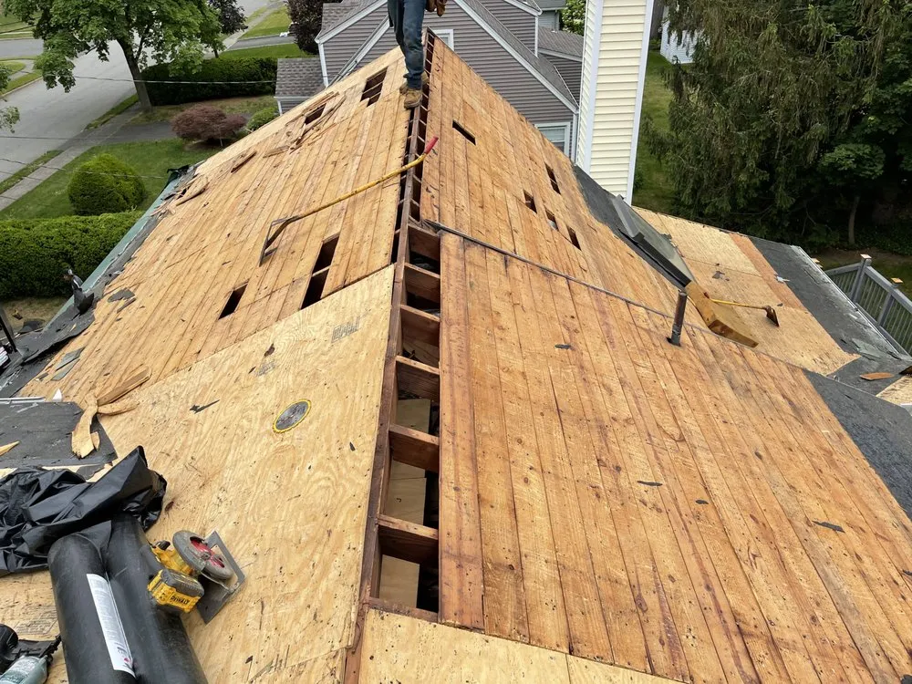 Slide of Three Brothers Roofing