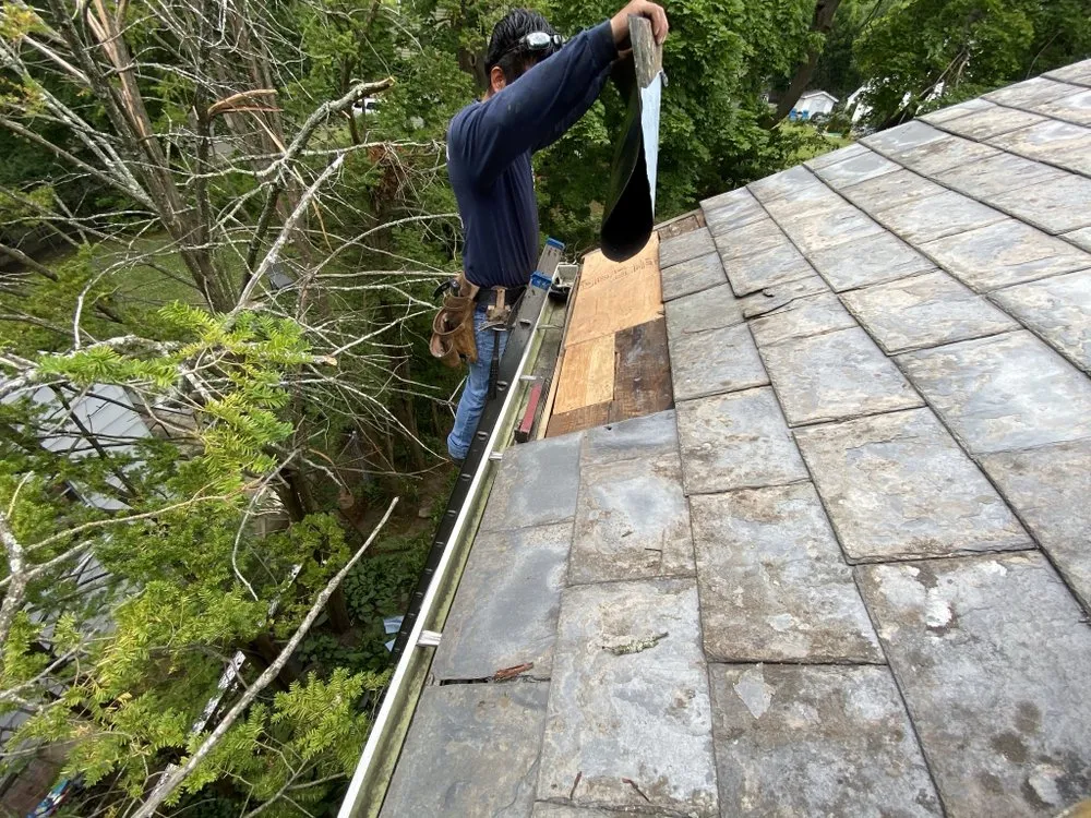 Slide of Three Brothers Roofing