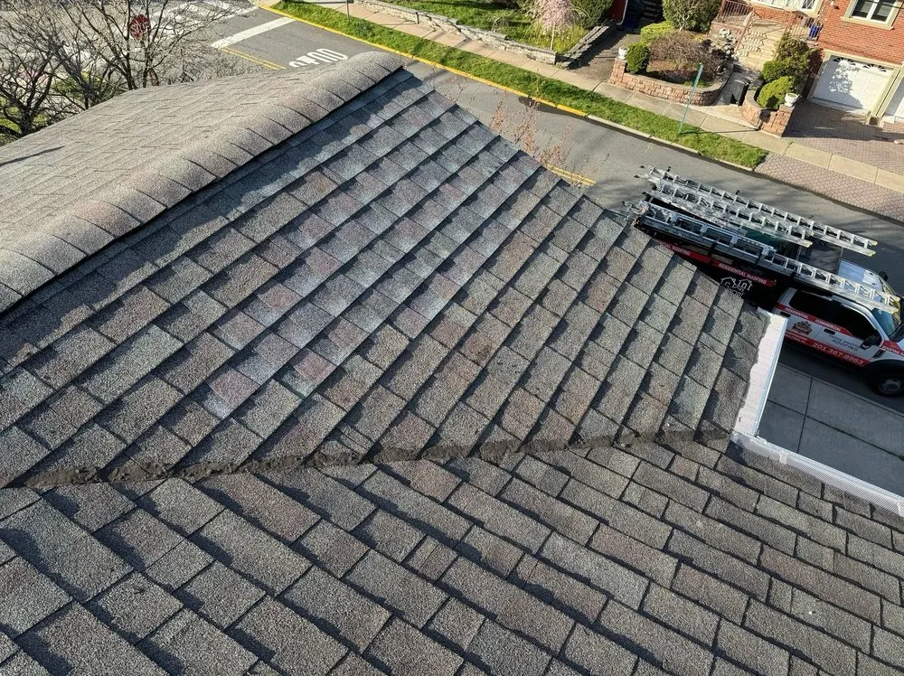 Slide of Three Brothers Roofing