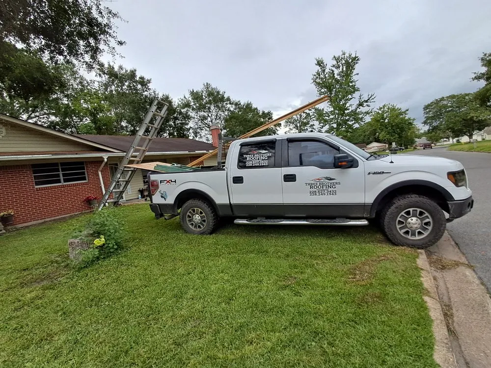 Slide of Three Brothers Roofing