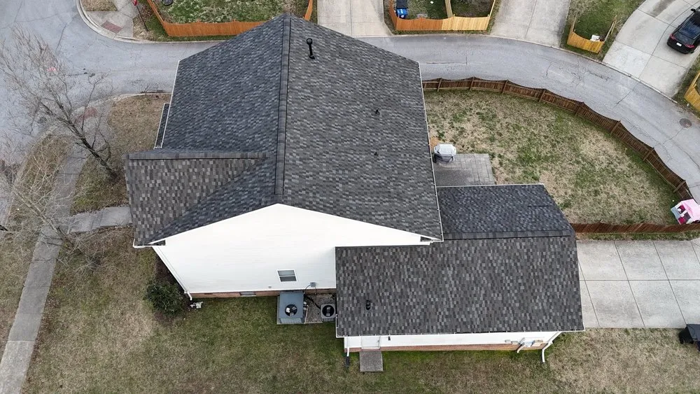 Slide of Three Stone Roofing