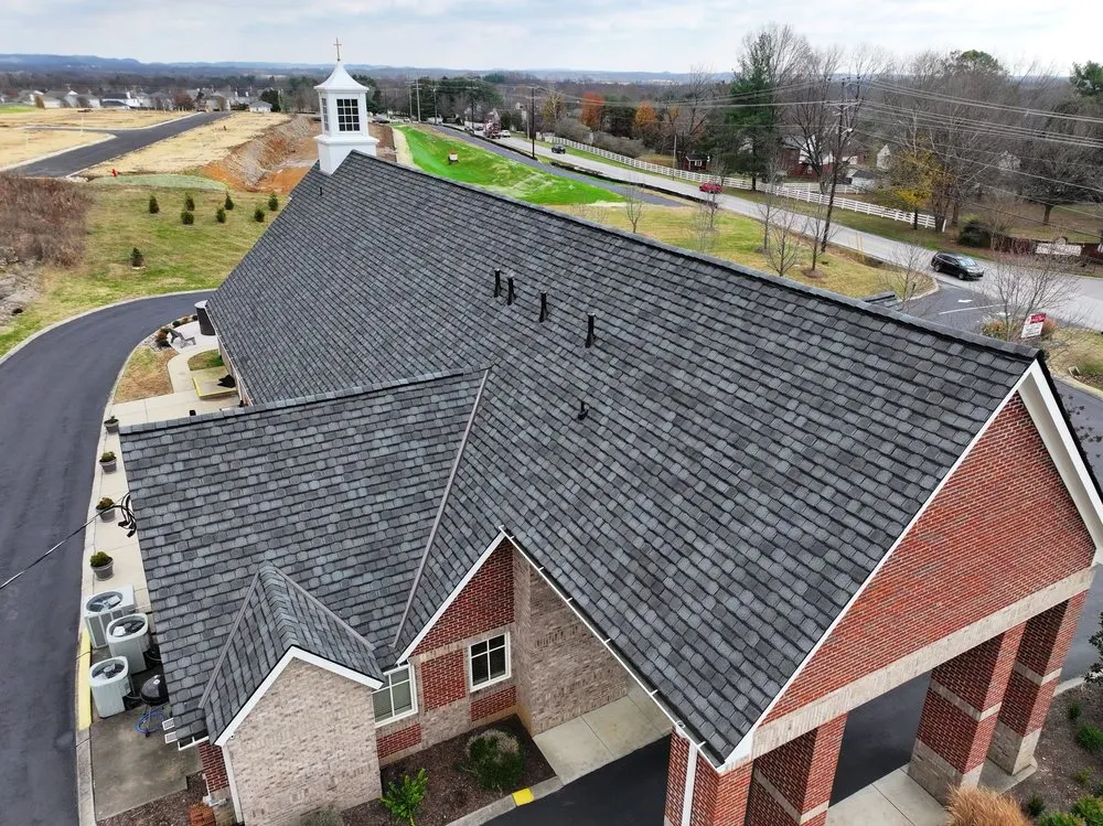 Slide of Three Stone Roofing
