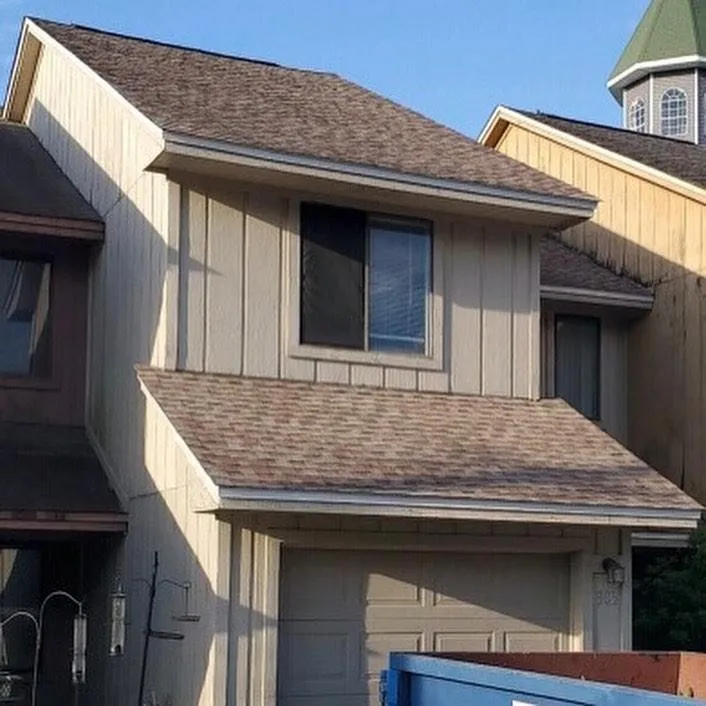 Slide of Timberman Roofing