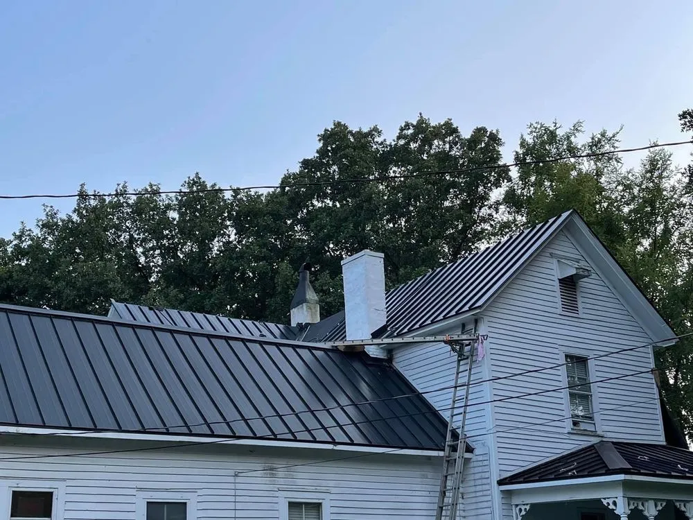 Slide of Tim's Roof Contractors