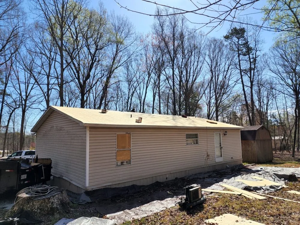 Slide of Tim's Roof Contractors