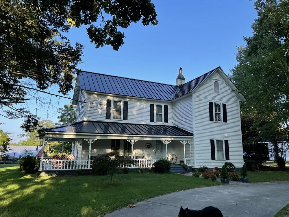 Slide of Tim's Roof Contractors