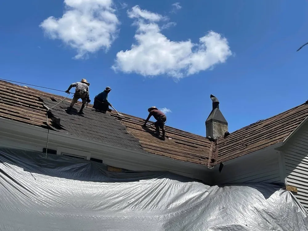 Slide of Tim's Roof Contractors