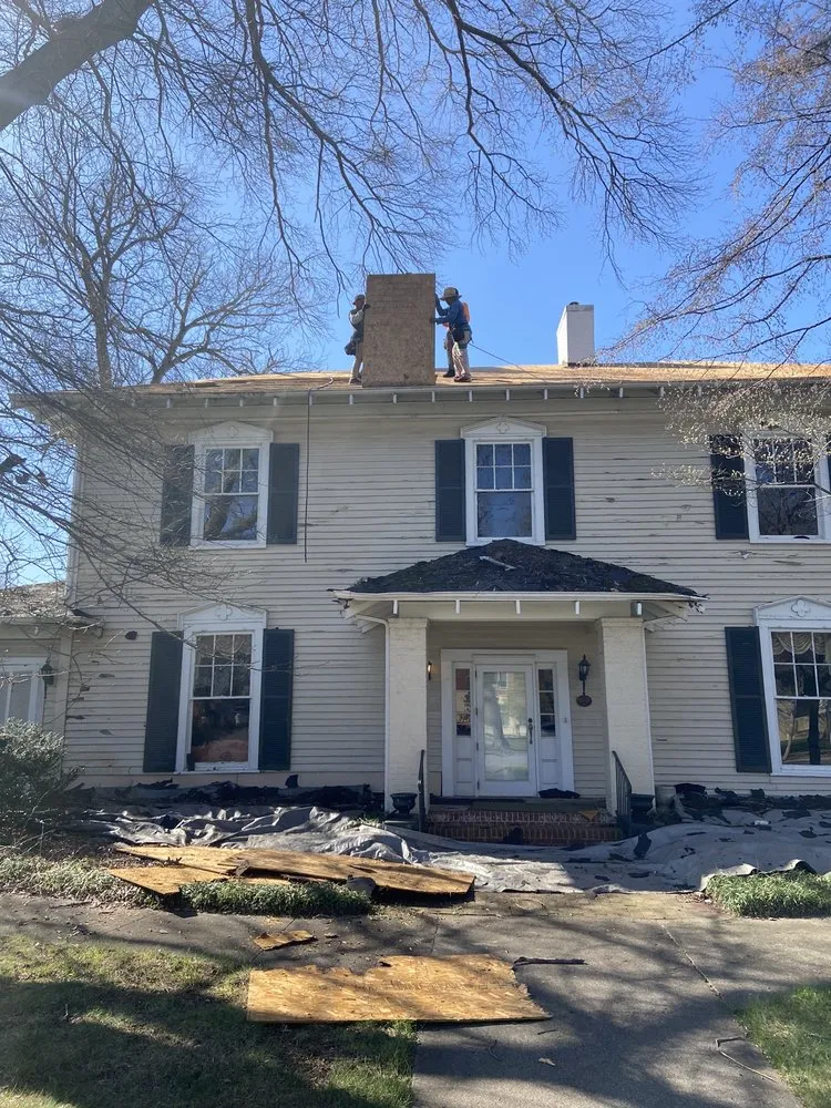 Slide of Tim's Roof Contractors