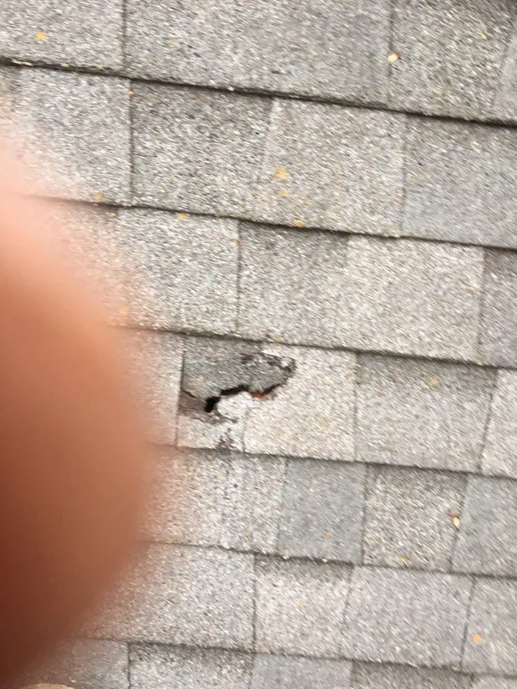 Slide of Tim's Roof Contractors