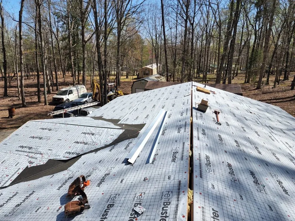 Slide of Tim's Roof Contractors