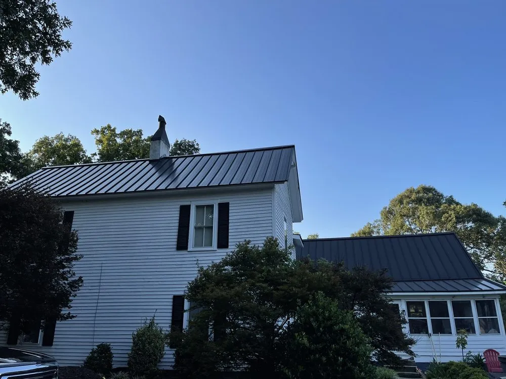 Slide of Tim's Roof Contractors