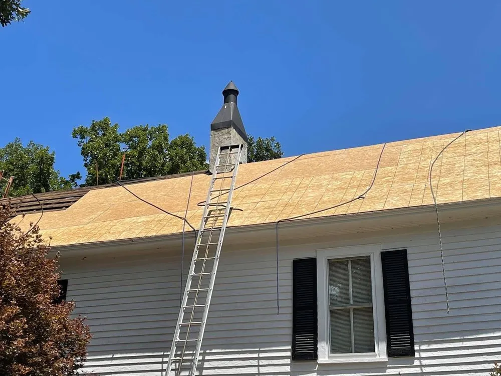 Slide of Tim's Roof Contractors