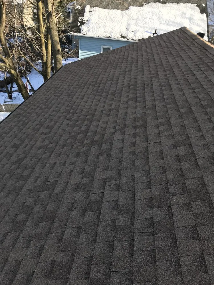 Slide of Tim’s Roofing services