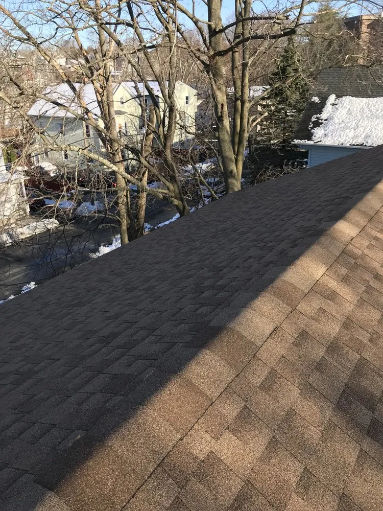 Slide of Tim’s Roofing services