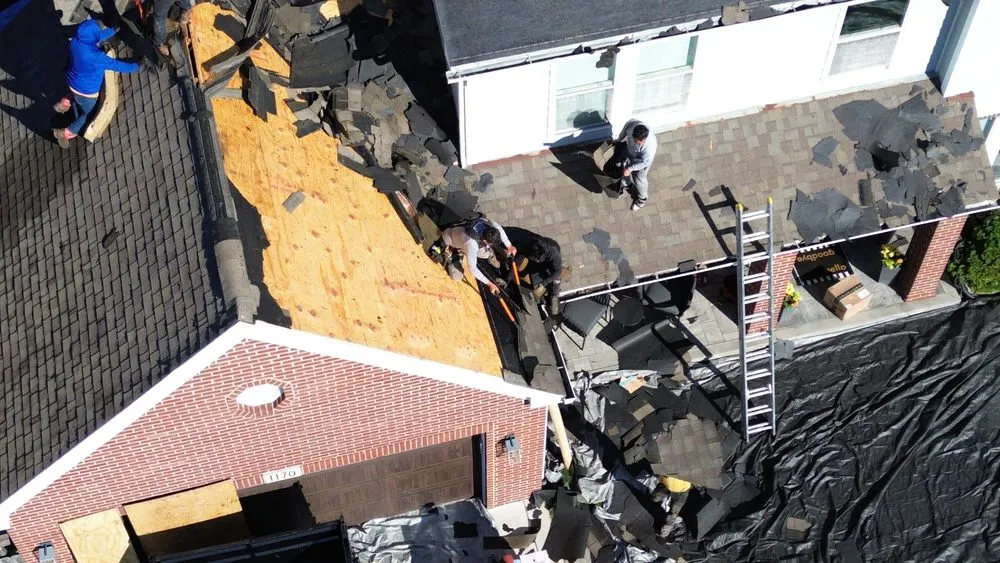 Slide of Tinos Roofing