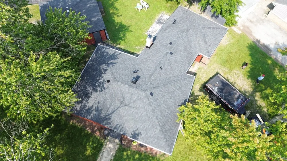 Slide of Tinos Roofing