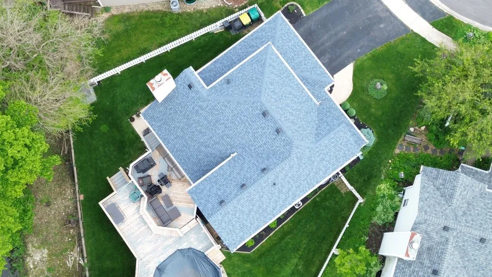 Slide of Tinos Roofing