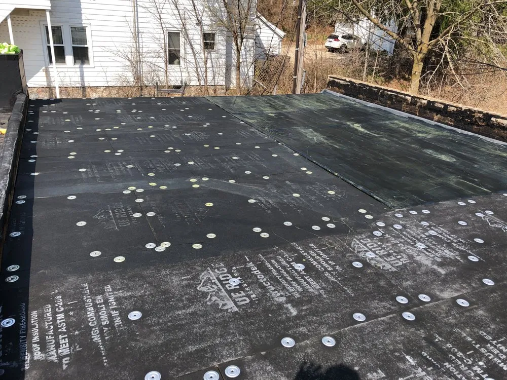 Slide of Tip Top Roofing & Gutters