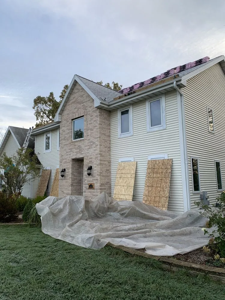 Slide of Tip Top Roofing & Gutters