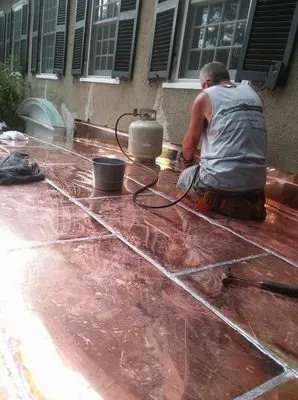 Slide of Tip Top Roofing Company