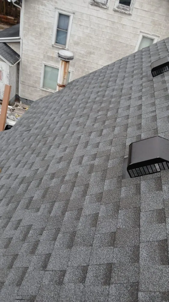 Slide of TK Roofing and Gutters