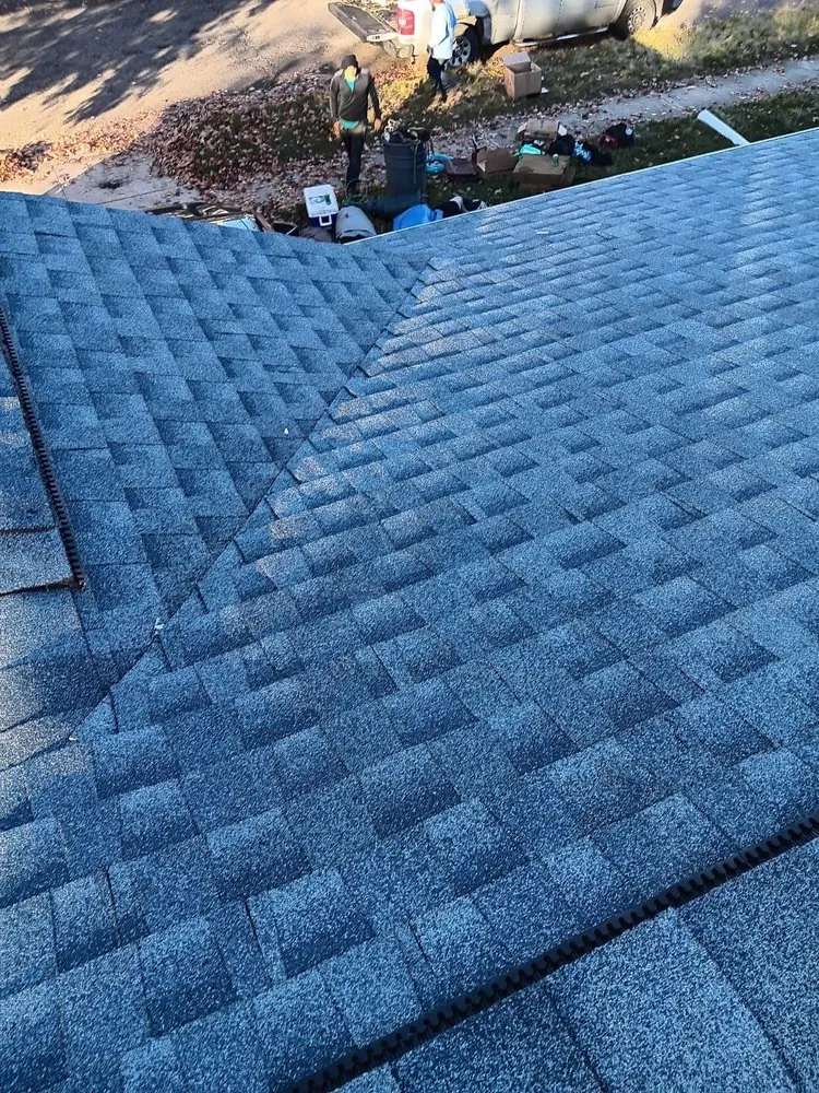 Slide of TK Roofing and Gutters