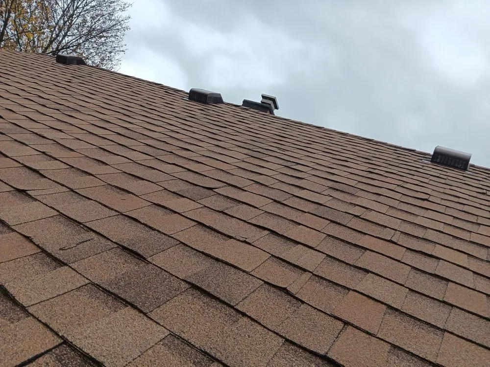 Slide of TK Roofing and Gutters