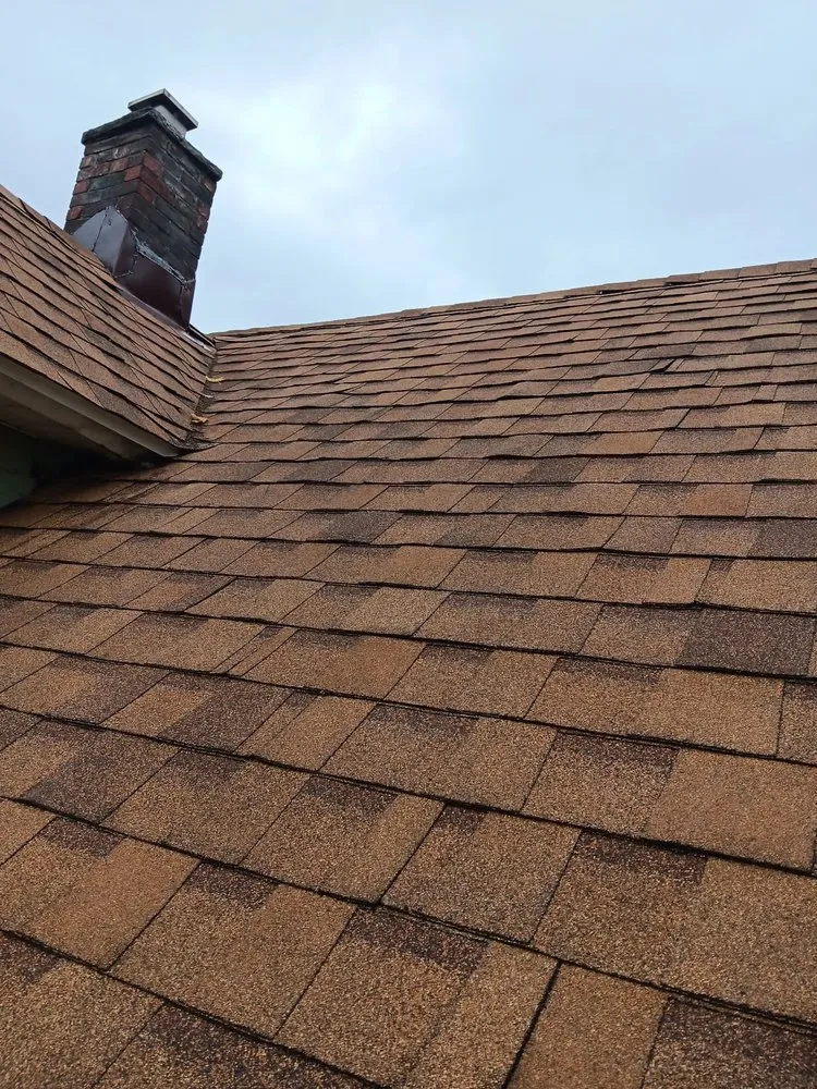 Slide of TK Roofing and Gutters