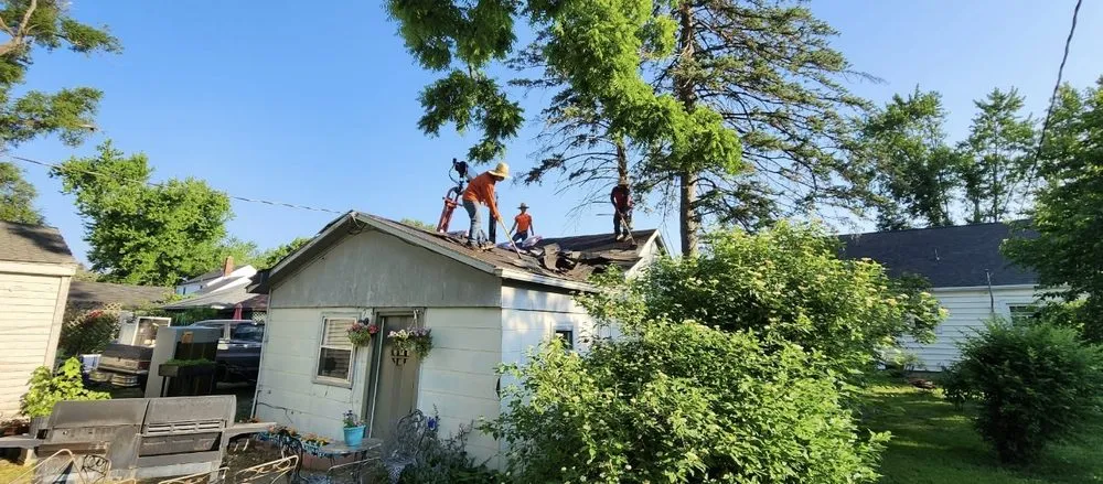 Slide of TM Roofing and Construction