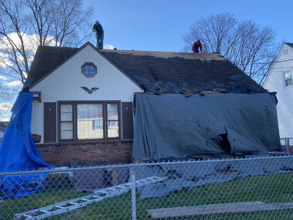 Slide of TM Roofing Siding