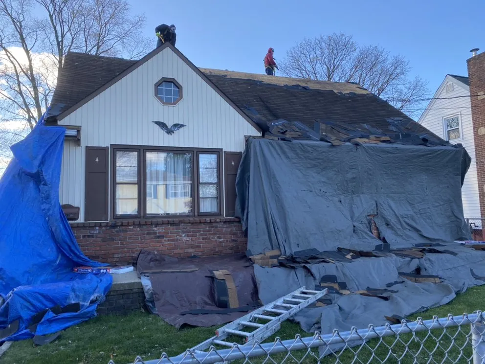 Slide of TM Roofing Siding