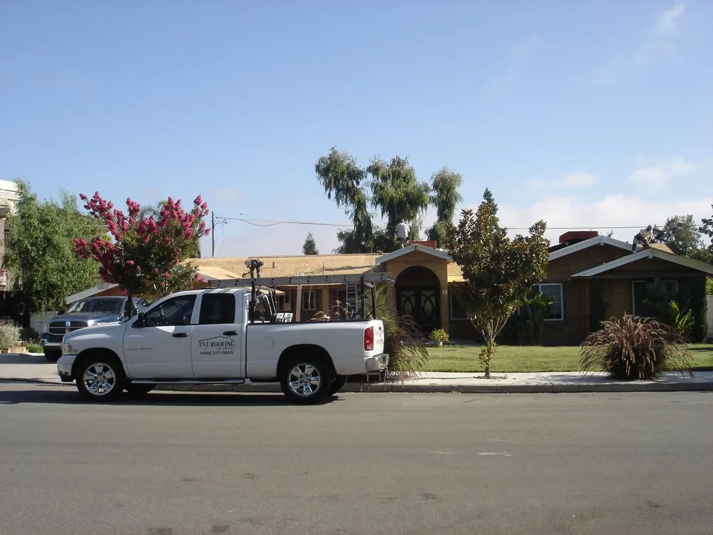 Slide of TNT Roofing