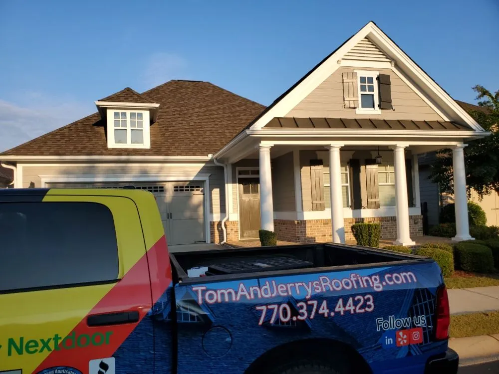 Slide of Tom and Jerry's Roofing