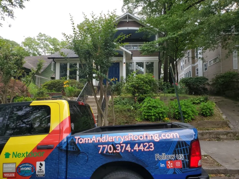 Slide of Tom and Jerry's Roofing