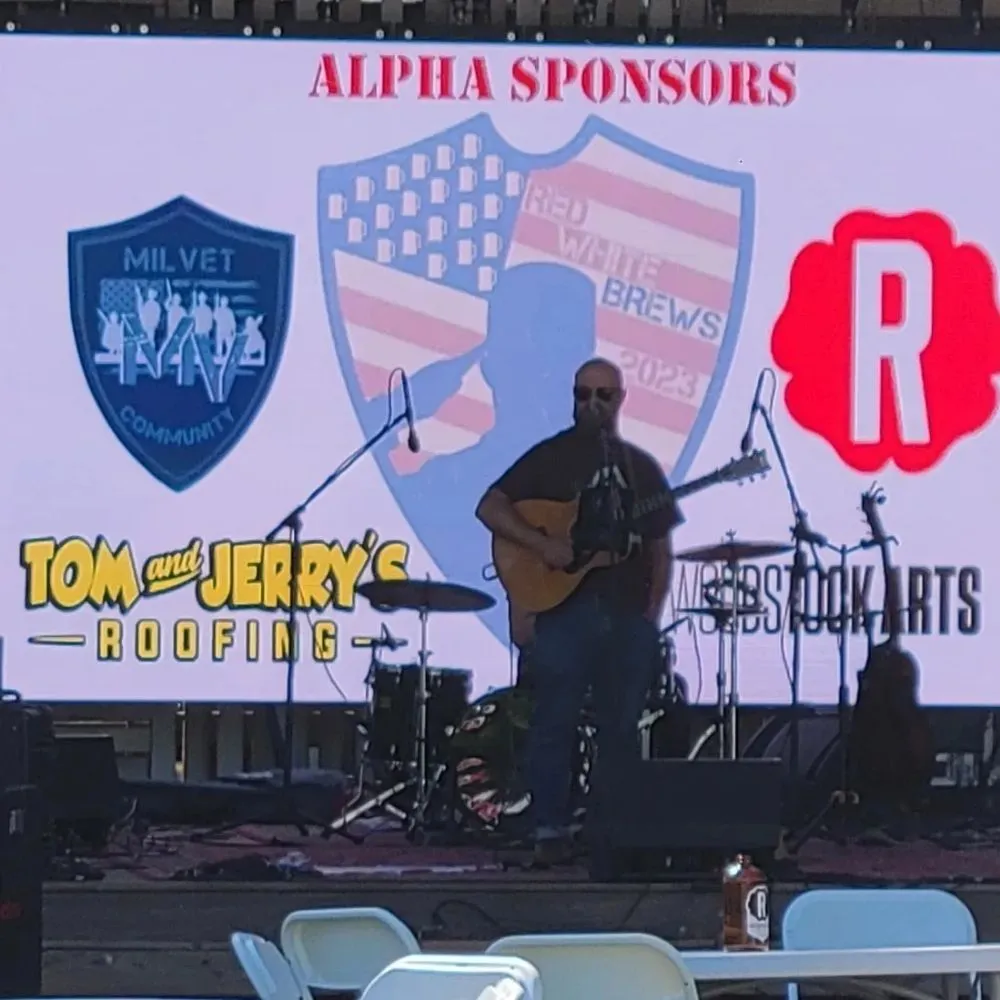 Slide of Tom and Jerry's Roofing