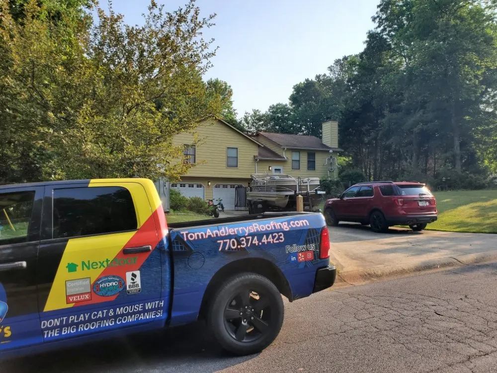 Slide of Tom and Jerry's Roofing