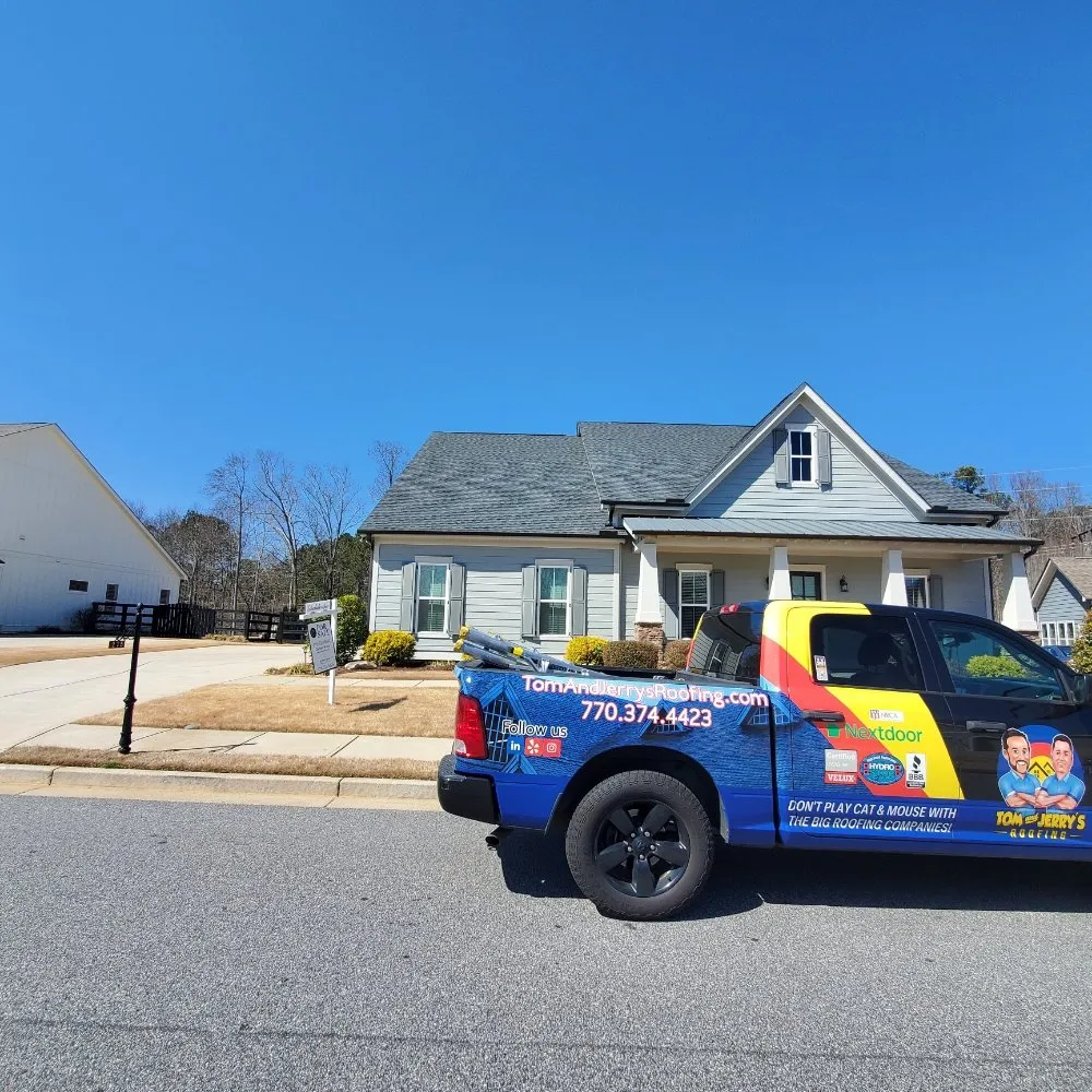 Slide of Tom and Jerry's Roofing
