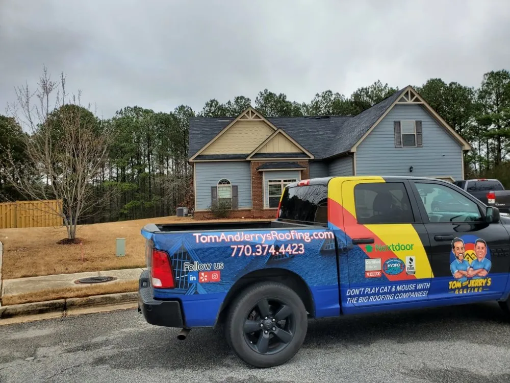 Slide of Tom and Jerry's Roofing