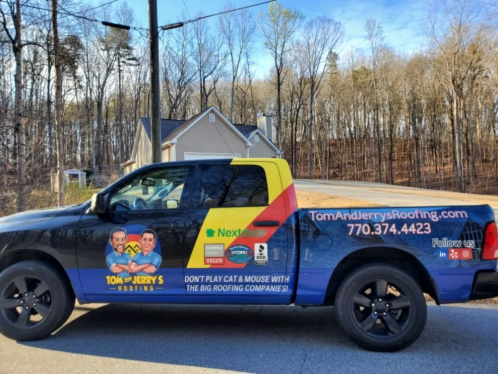 Slide of Tom and Jerry's Roofing