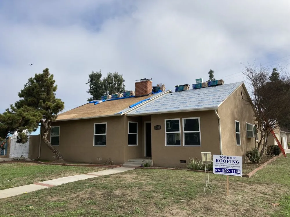 Slide of Tom Byer Roofing Service