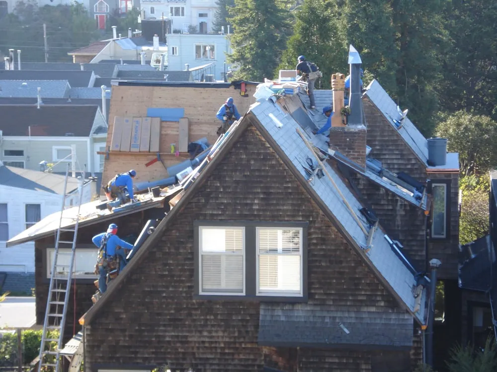 Slide of Tom Lee Roofing