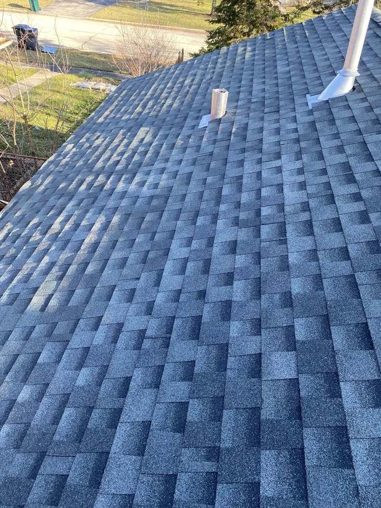 Slide of Tommys Roofing