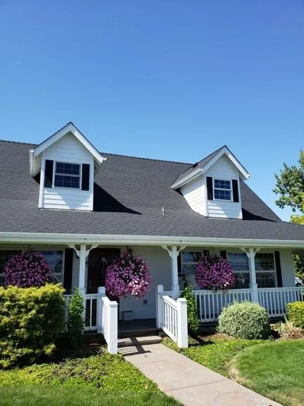 Slide of Tom's Roofing