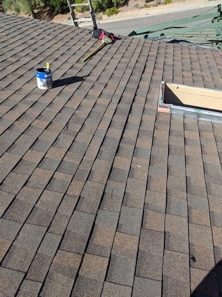 Slide of Tom's Roofing Services